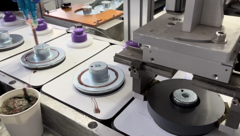 Wholesale car audio products in a warehouse with speakers and amplifiers.