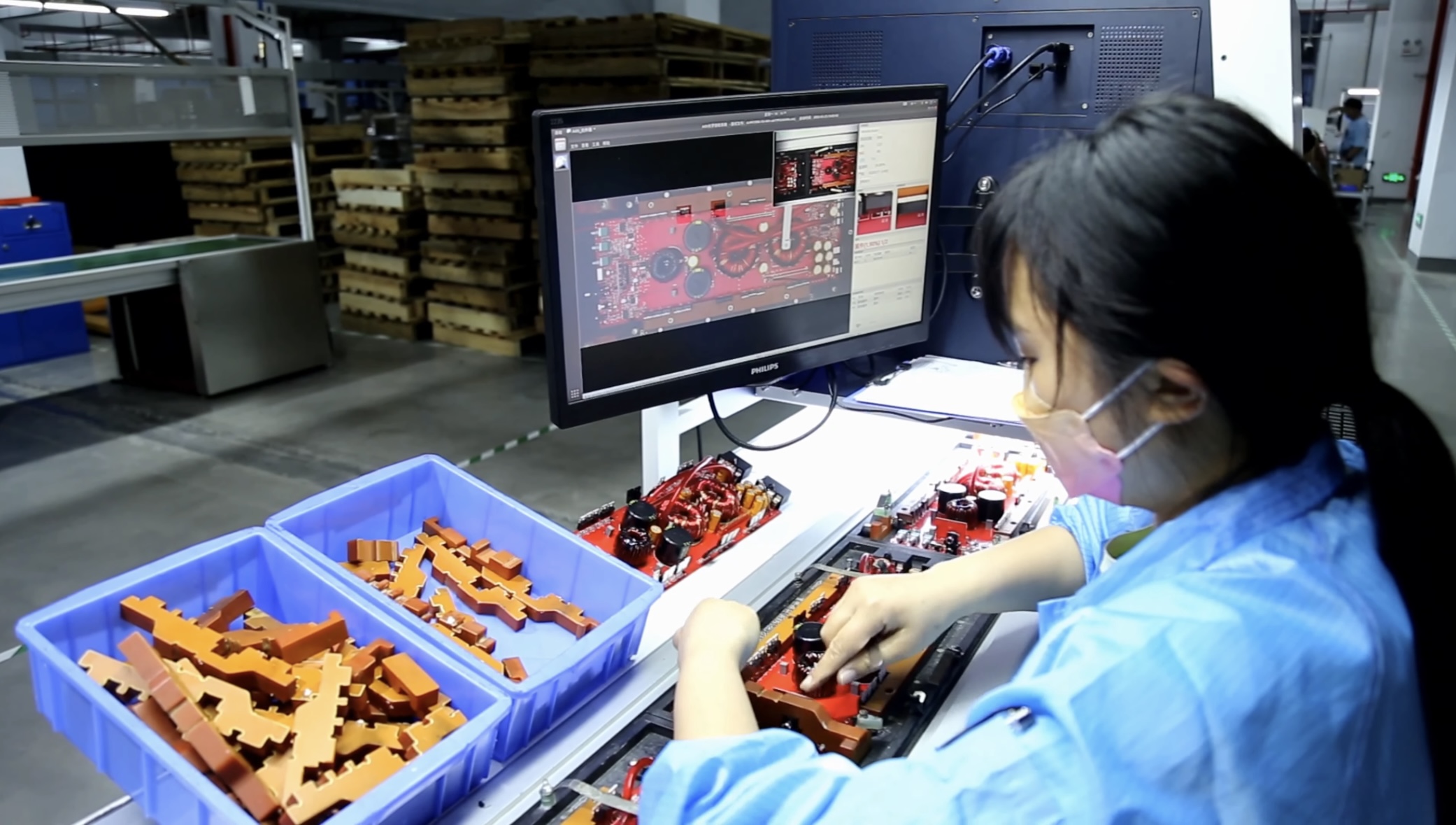 Speaker components close-up showing cone, coil, and magnet.